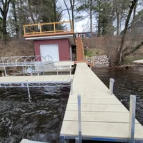 New dock installation reaching from shore to the water